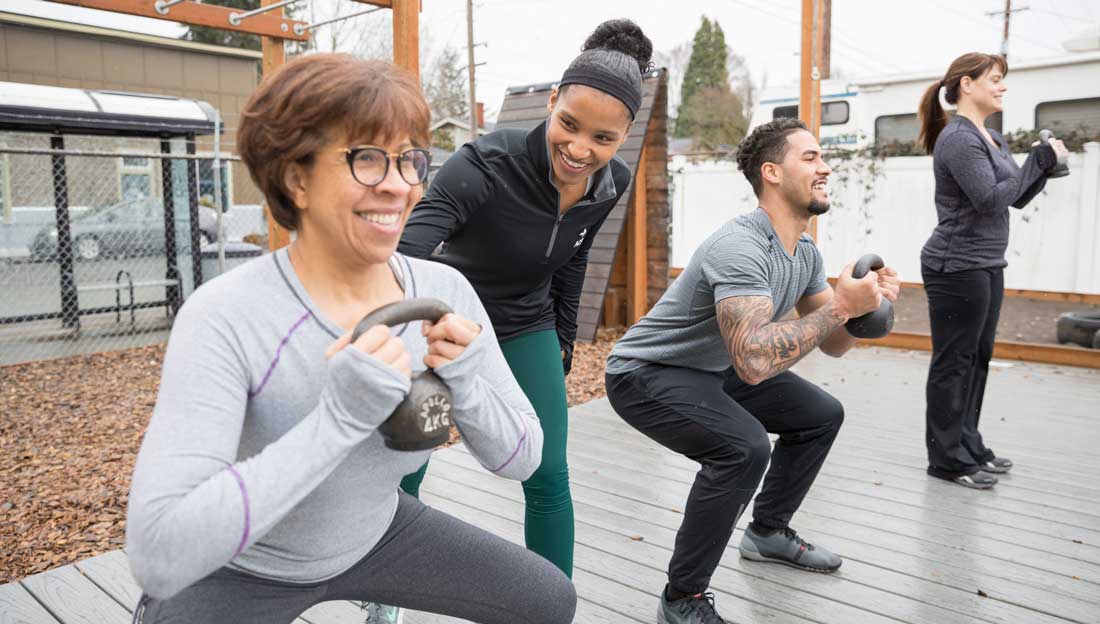 Does Group Fitness Offer More Health Benefits Than Exercising Alone?