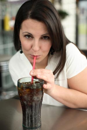 woman sipping soda