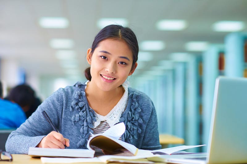 Female studying in library
