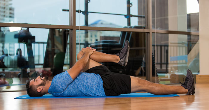 lying knee to chest stretch
