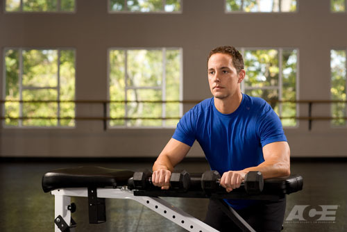 palms down wrist curl over a bench